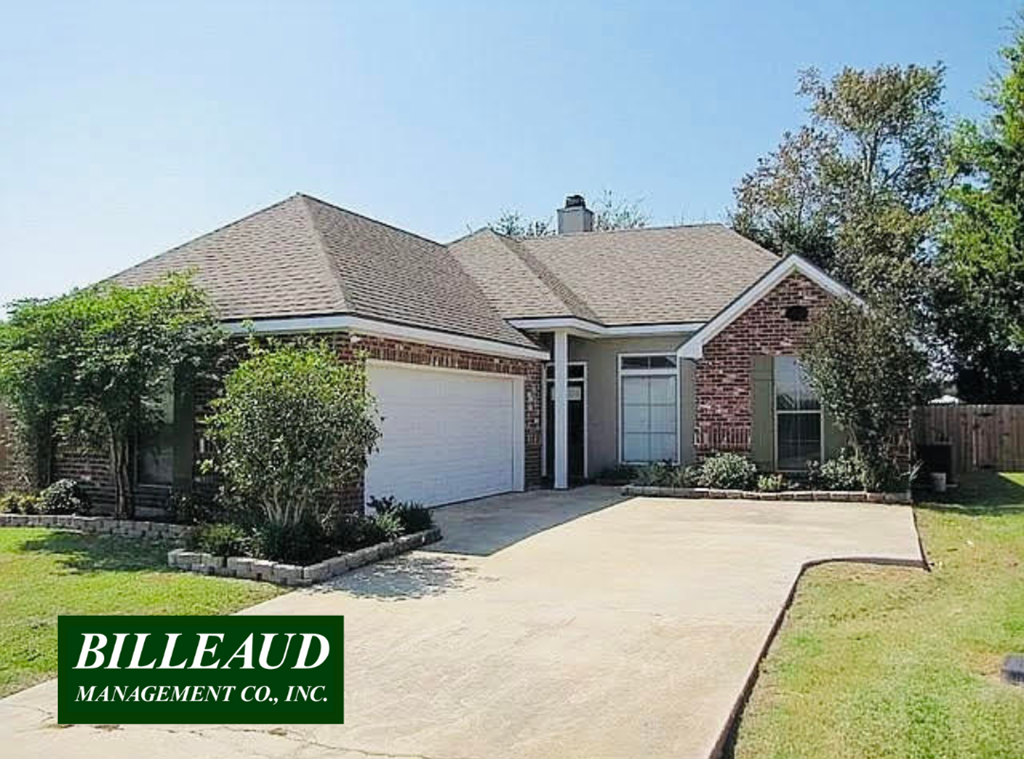 a house with a driveway and a garage door