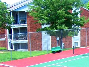 a tennis court with a fence around it