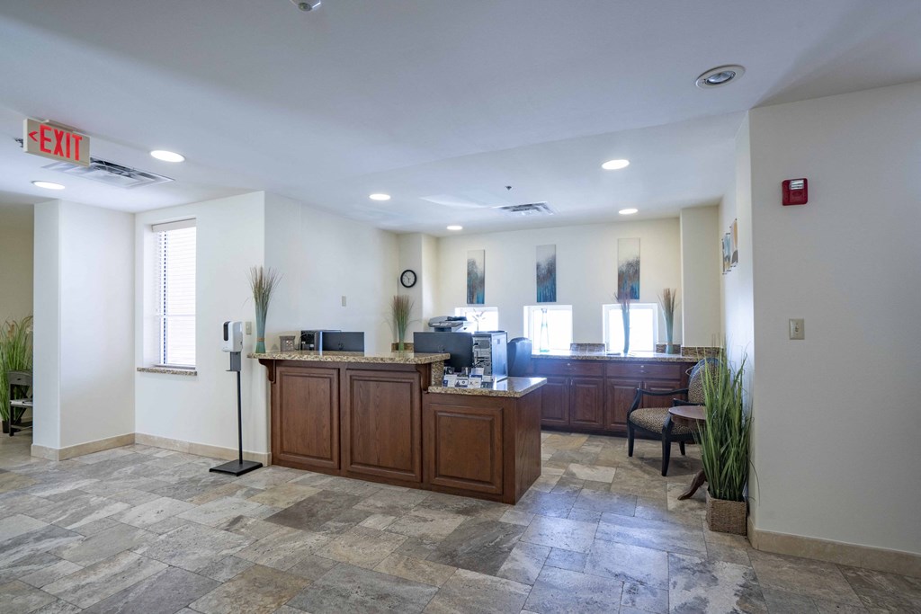 a lobby with an office and a reception desk