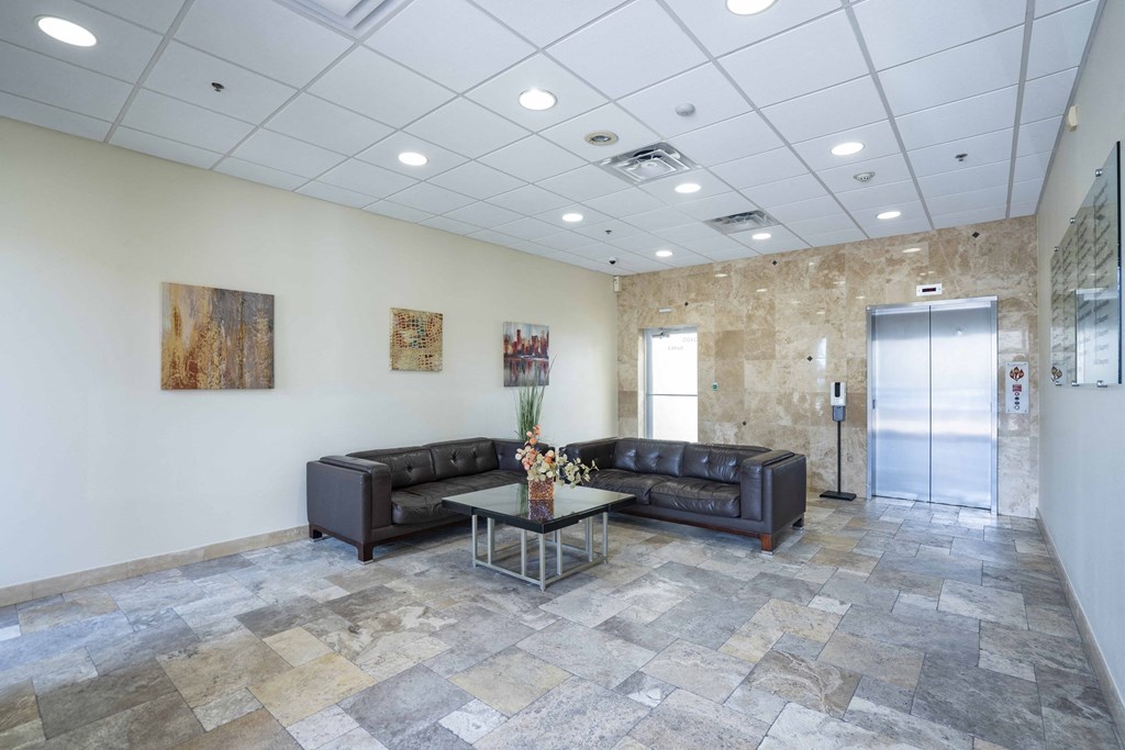 the preserve at cardinal courts lobby with couches and a table