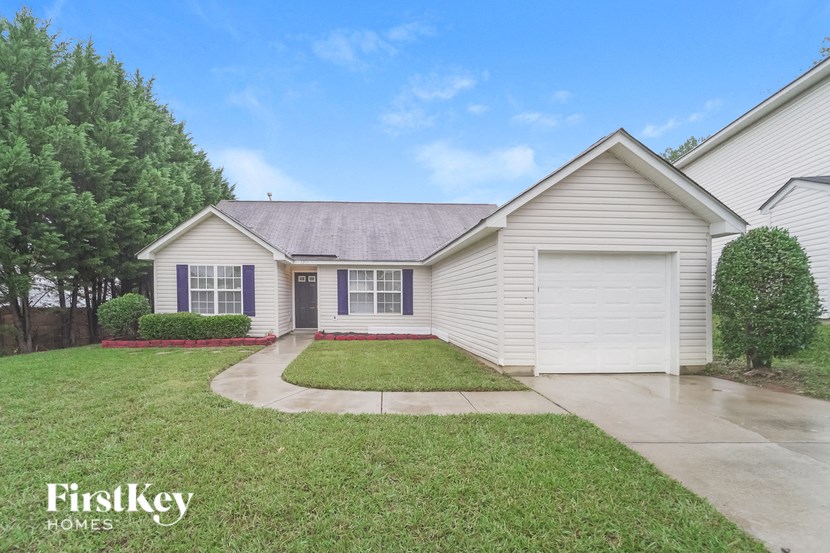 A house with a garage is for sale by FirstKey Homes.