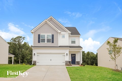 A house with a garage is for sale by FirstKey Homes.