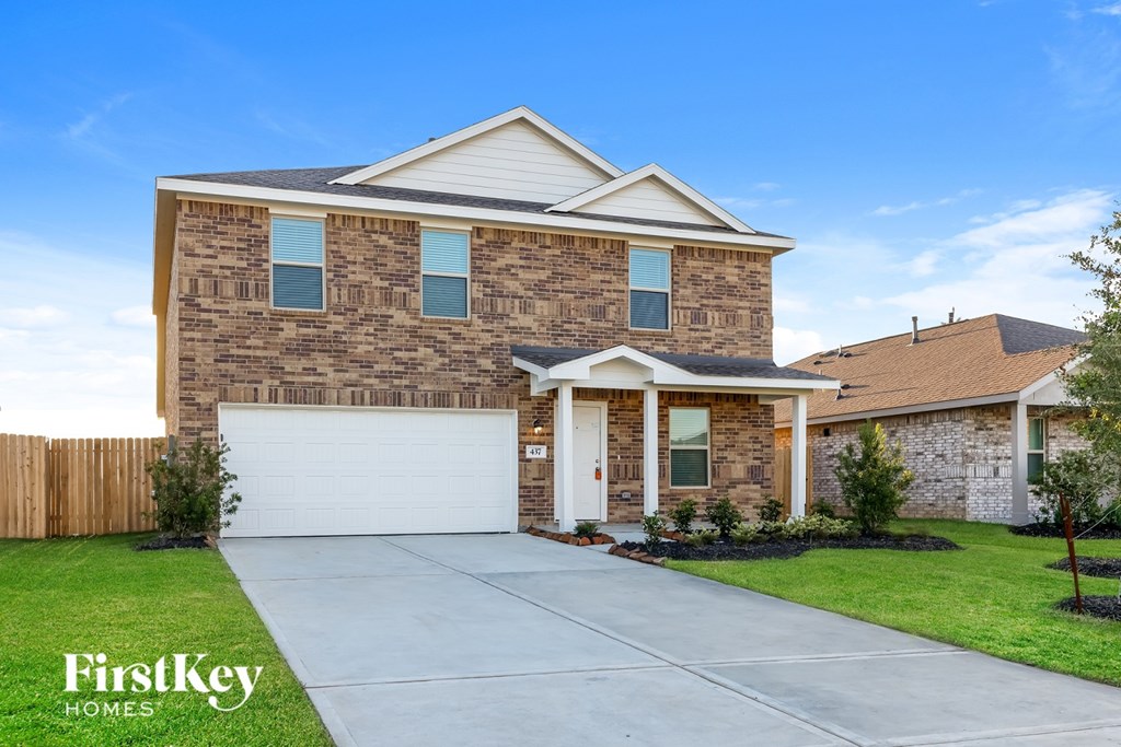 A house with a garage is for sale by FirstKey Homes.