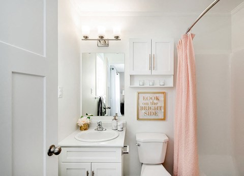 a small bathroom with a sink toilet and a mirror