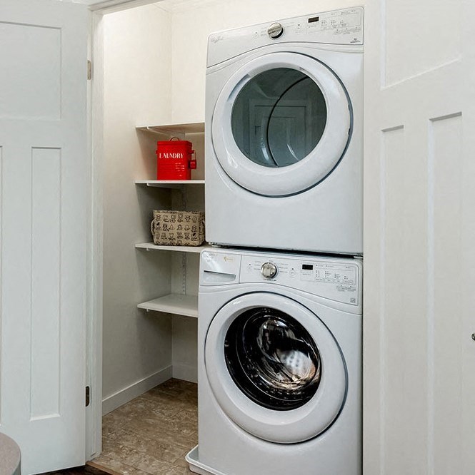 a small laundry room with a washing machine and a dryer