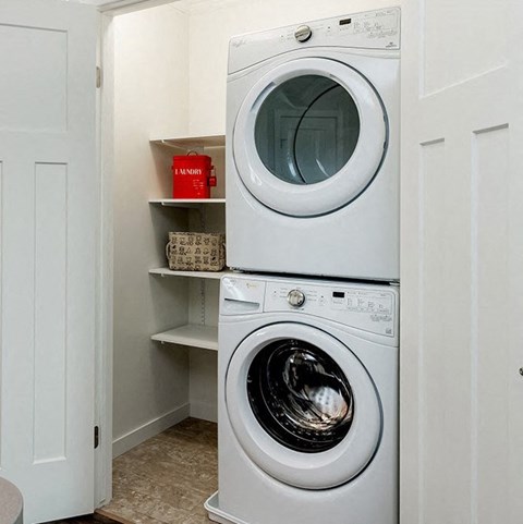 a small laundry room with a washing machine and a dryer