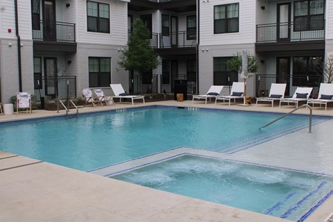 our apartments have a large pool and lounge chairs