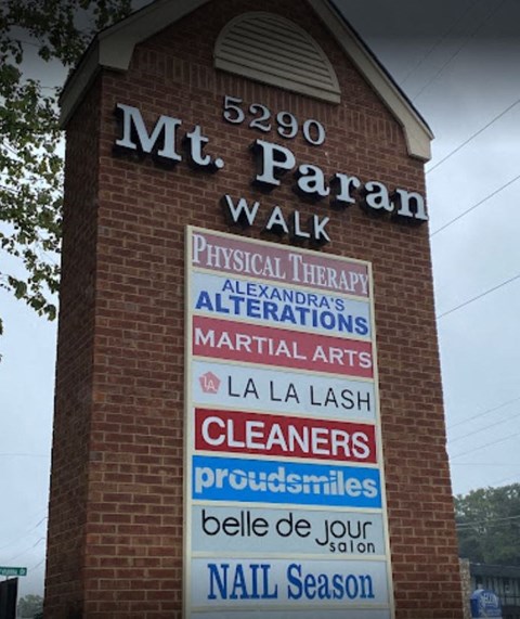 A sign for Mt. Paran Walk with various businesses listed.