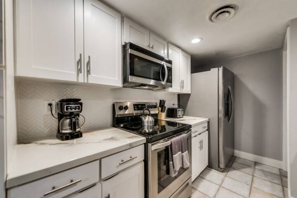 a kitchen with a stove microwave and refrigerator
