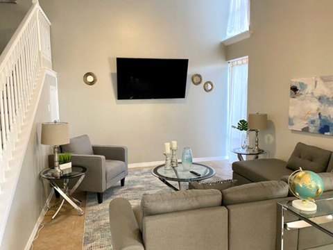 a living room with couches and a television