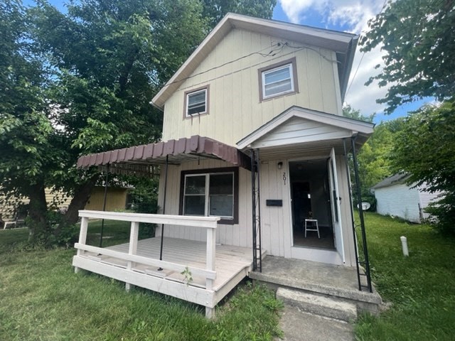 a tiny house with a porch and a deck
