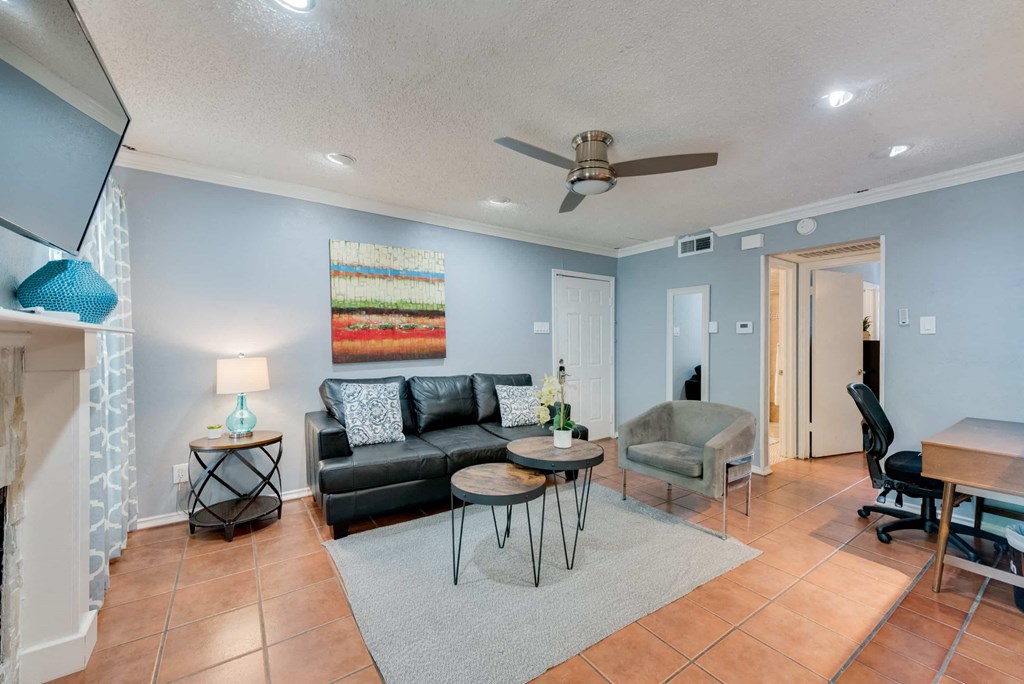 a living room with a couch and a table