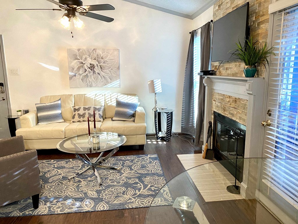 a living room with a couch and a fireplace