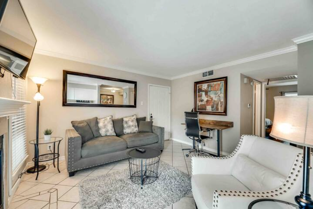 a living room with a couch and a chair