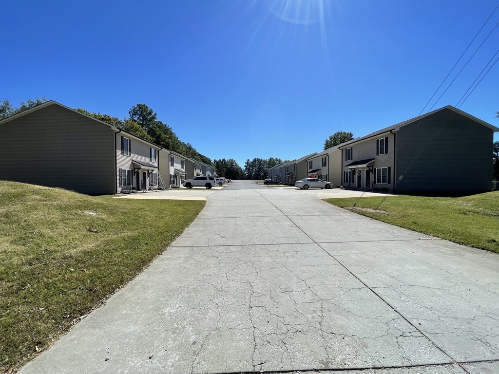 a row of houses on the side of a street