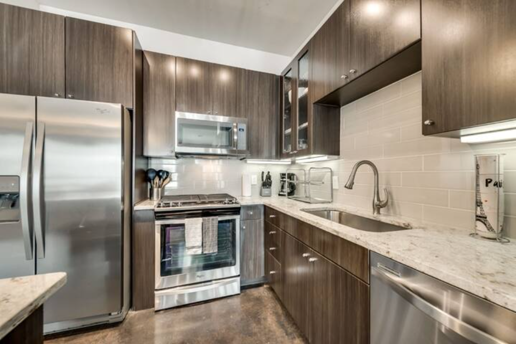 a kitchen with stainless steel appliances and a sink