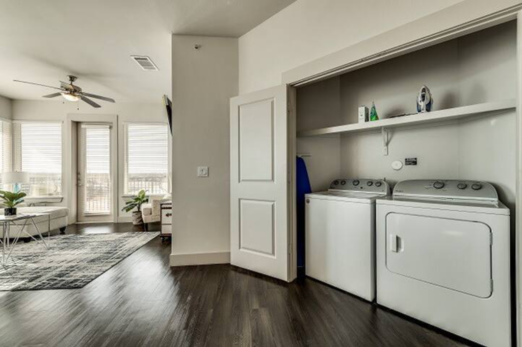 a room with a washer and a dryer in it