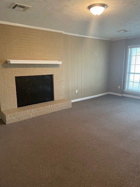 a living room with a fireplace and a carpet