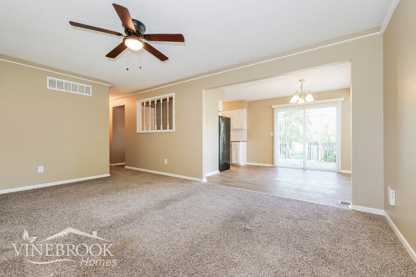 the living room and dining room are open to the kitchen