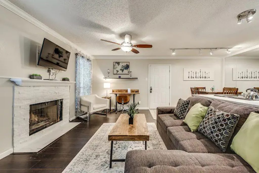 a living room with a couch and a fireplace