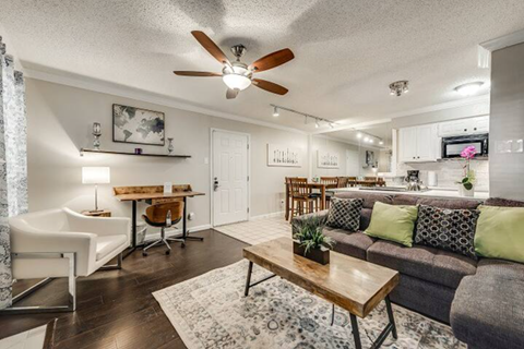 a living room with a couch and a table