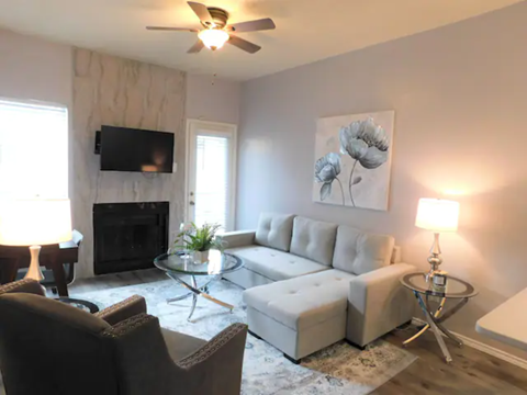 a living room with a couch and a table