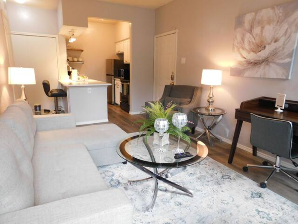 a living room with a couch and a table