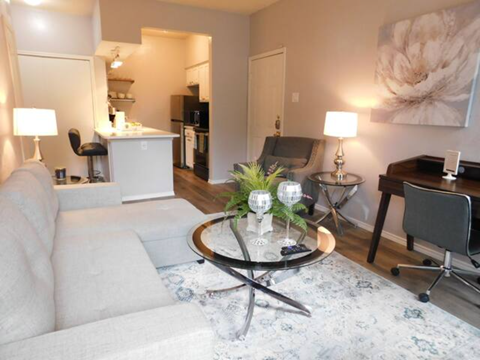 a living room with a couch and a table