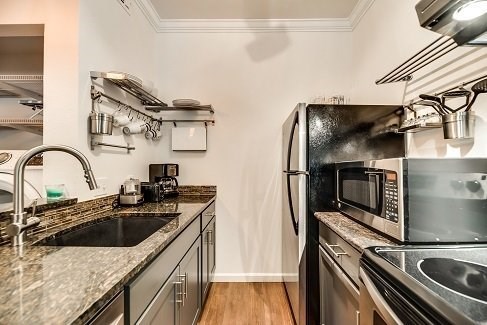 a kitchen with stainless steel appliances and a sink