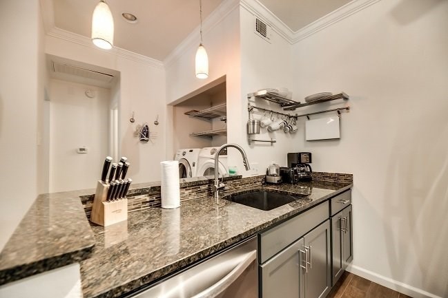 a kitchen with a sink and a counter top