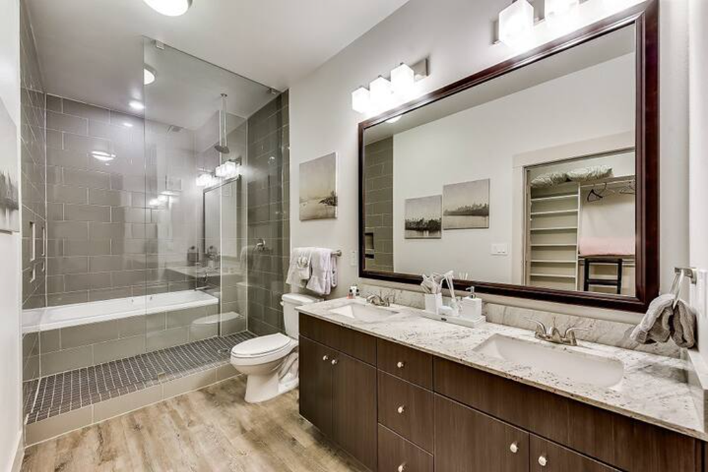 a bathroom with a shower toilet and a sink