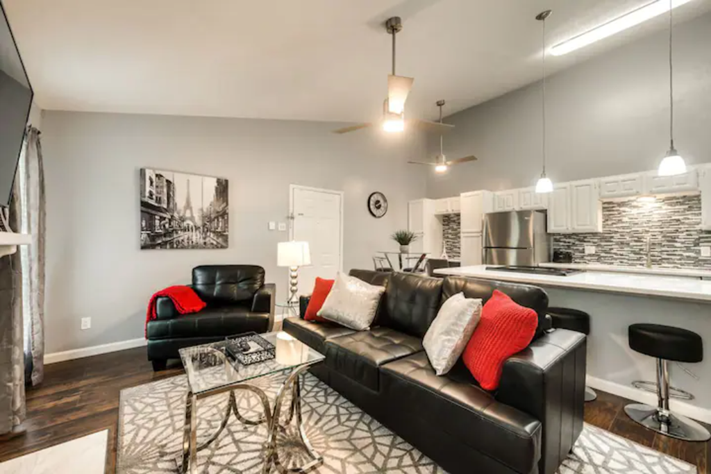 a living room with a leather couch and a table