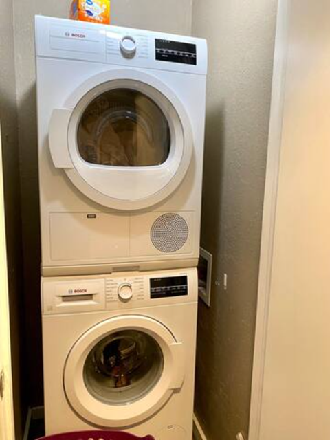 a washing machine and dryer in a small closet