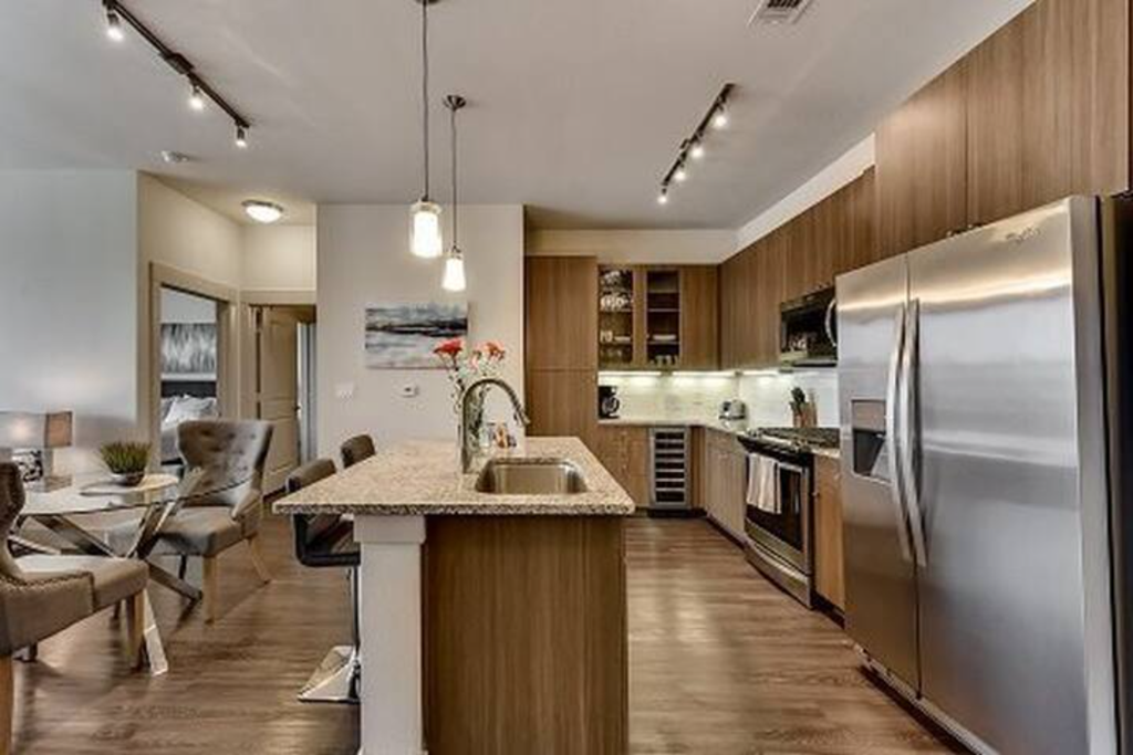 a kitchen with stainless steel appliances and a counter top