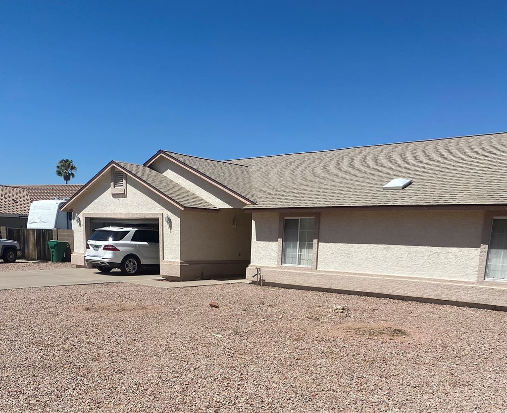 a house with a car parked outside of it