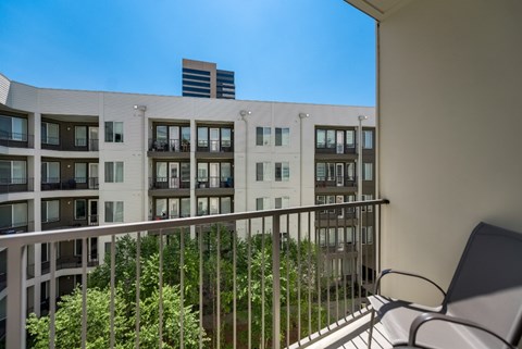 the view from the balcony of an apartment building on a sunny day