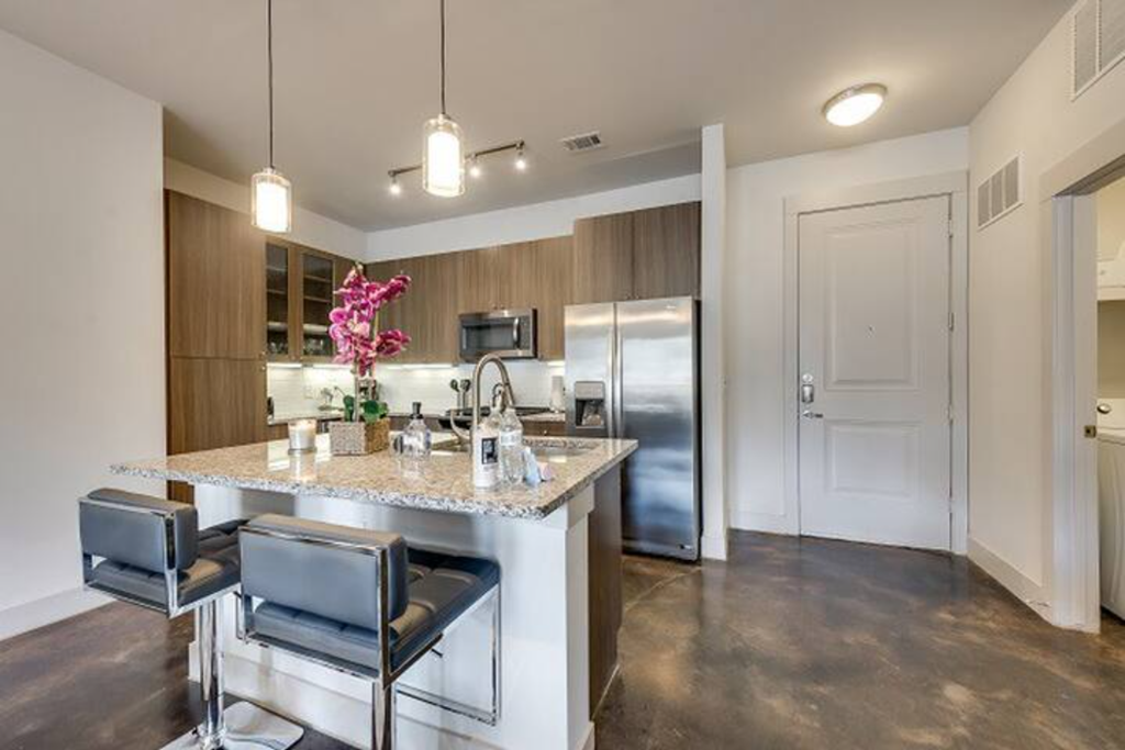 a kitchen with a counter top and a refrigerator