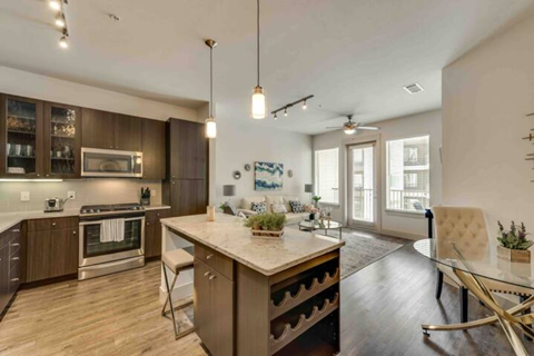 a kitchen and dining room with a table and chairs