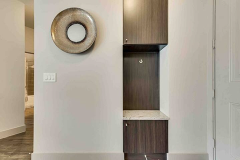 a bathroom with a sink and a mirror on the wall