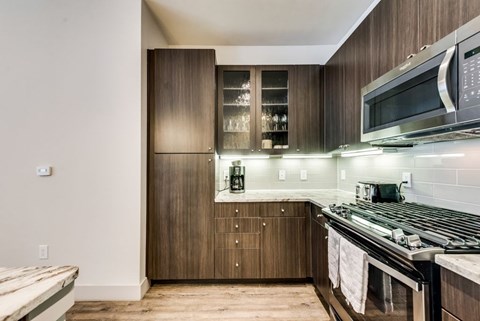 a kitchen with a stove and a microwave