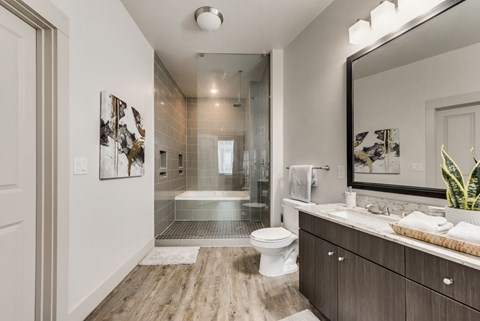 a bathroom with a toilet sink and a shower