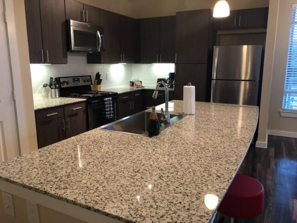 a kitchen with a granite counter top