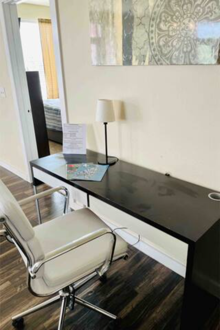 a office with a chair and a desk