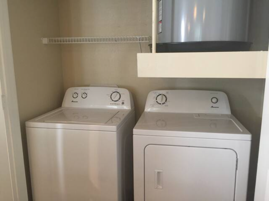 a white washer and dryer in a room