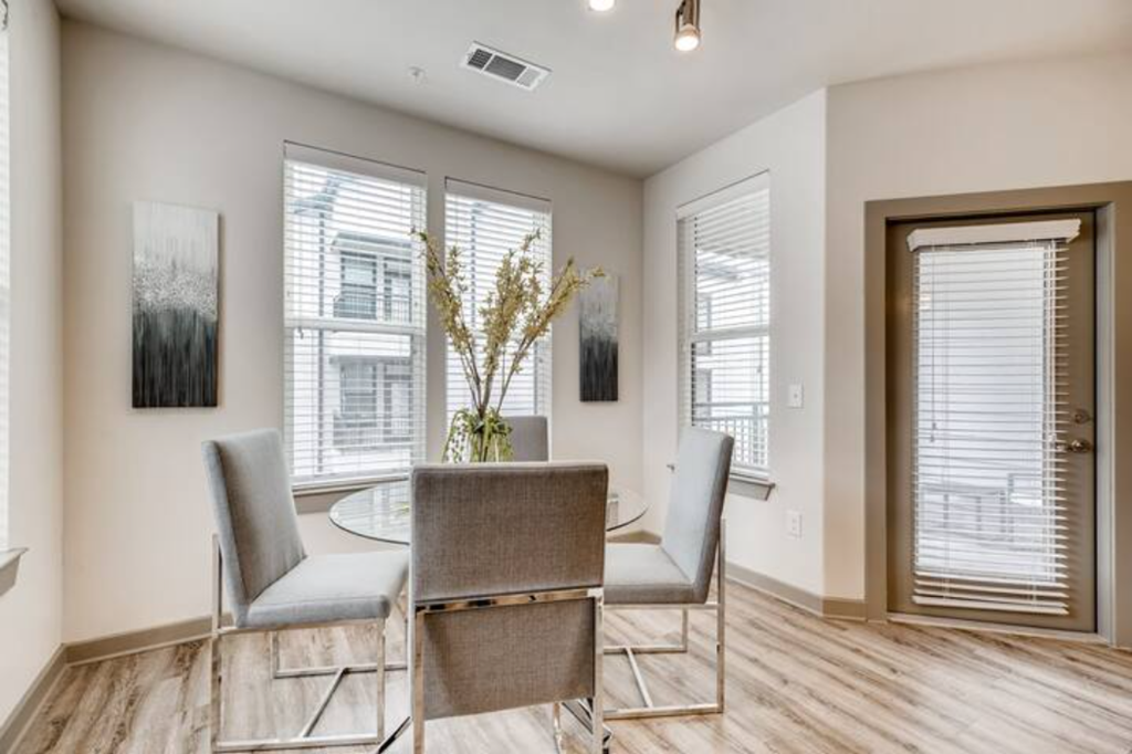 a dining room with a table and chairs