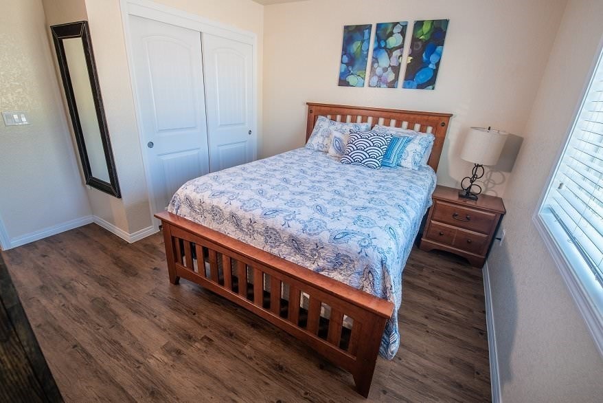 a bedroom with a bed and a window