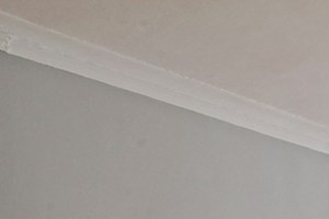 642W an empty room with a ceiling fan and two windows