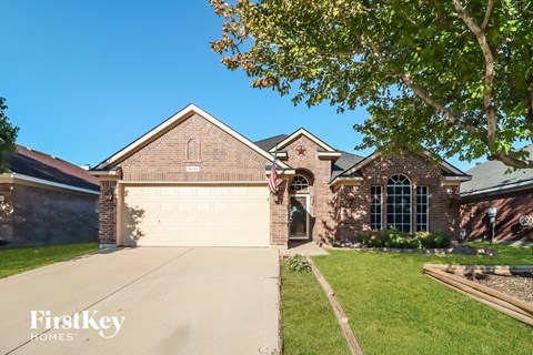 a house with a driveway and a garage door