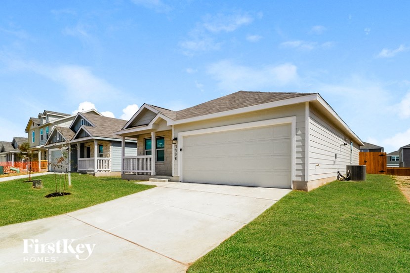 a home with a driveway and a garage door