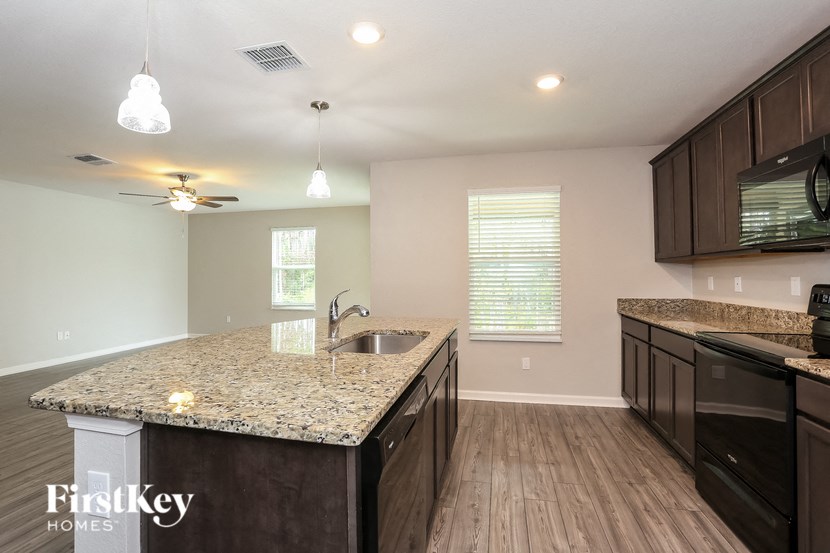 a kitchen with a granite counter top and a sink